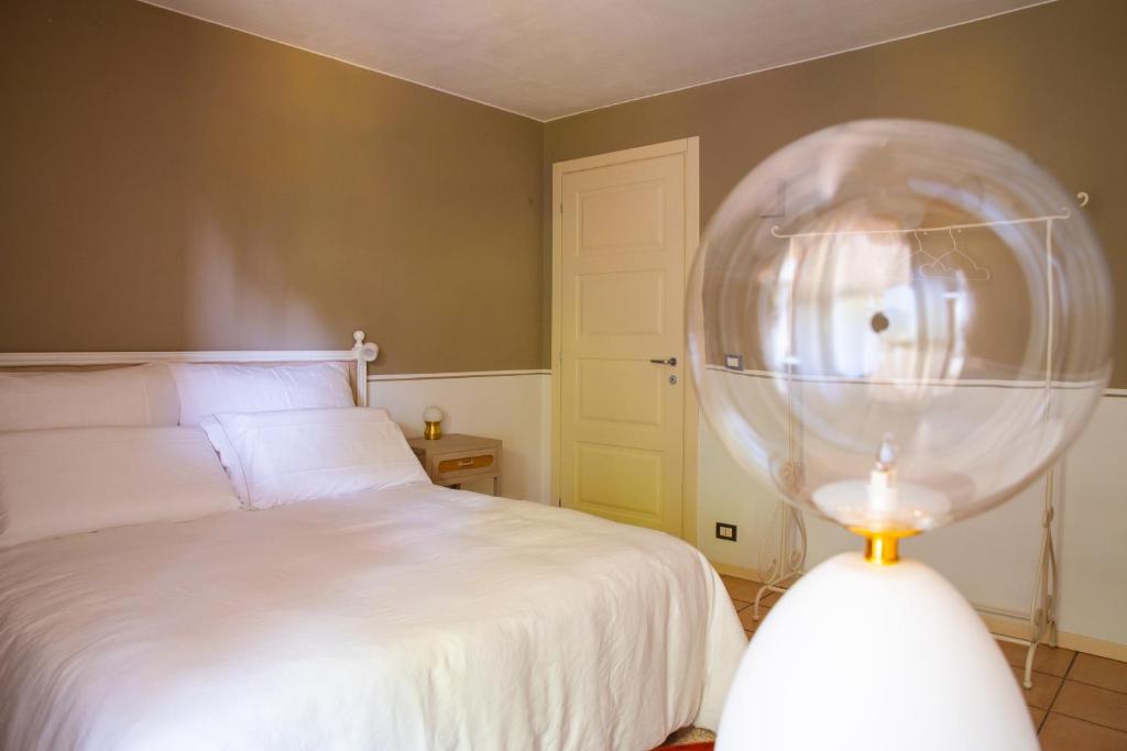 Postel nebo postele na pokoji v ubytování ghigorotto, suite&villa