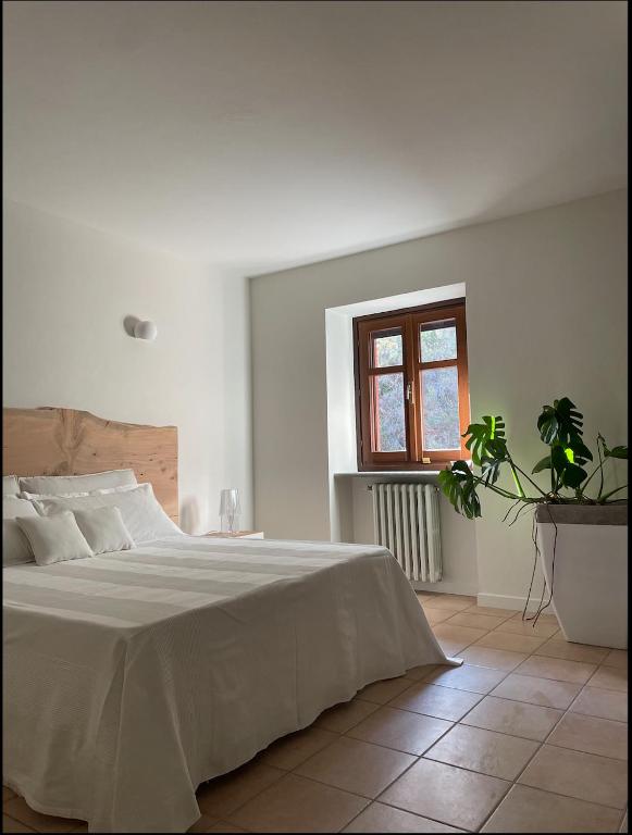 Postel nebo postele na pokoji v ubytování ghigorotto, suite&villa