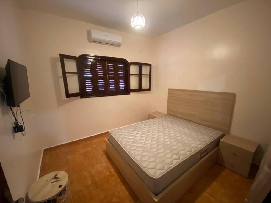 Postel nebo postele na pokoji v ubytování Lina’s house
