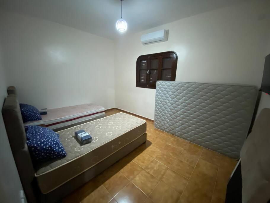 Postel nebo postele na pokoji v ubytování Lina’s house