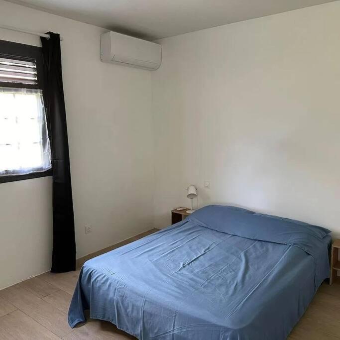 Postel nebo postele na pokoji v ubytování Au vert, proche des plages