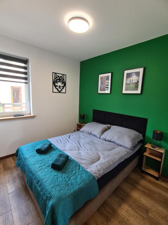Postel nebo postele na pokoji v ubytování Noclegi przy Wiadukcie - Apartamenty