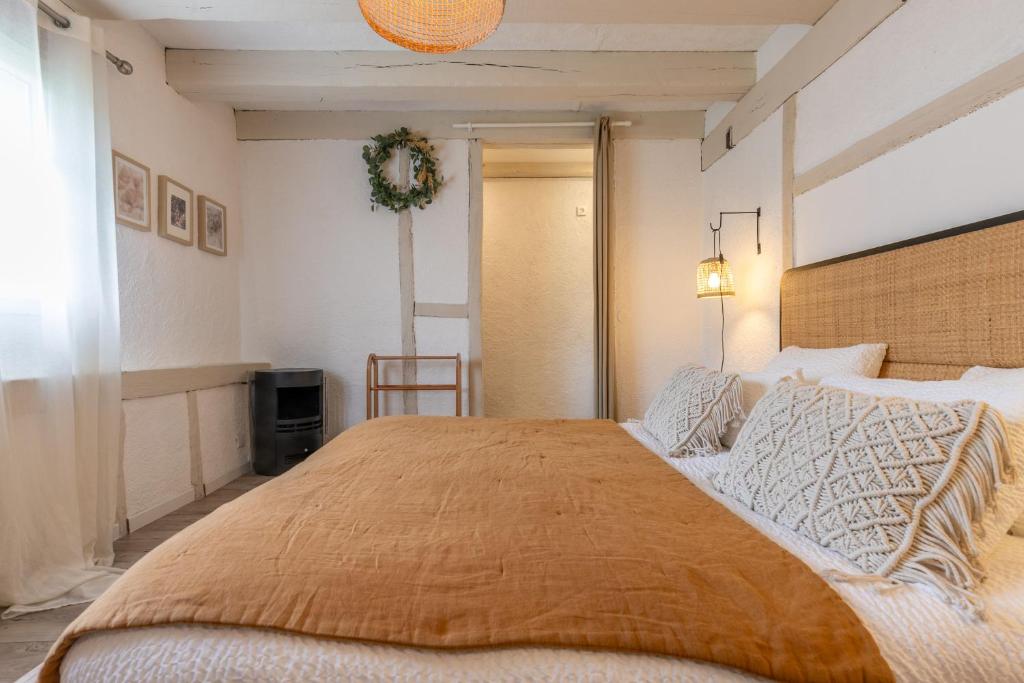 Posteľ alebo postele v izbe v ubytovaní Le Cottage de Chitenay