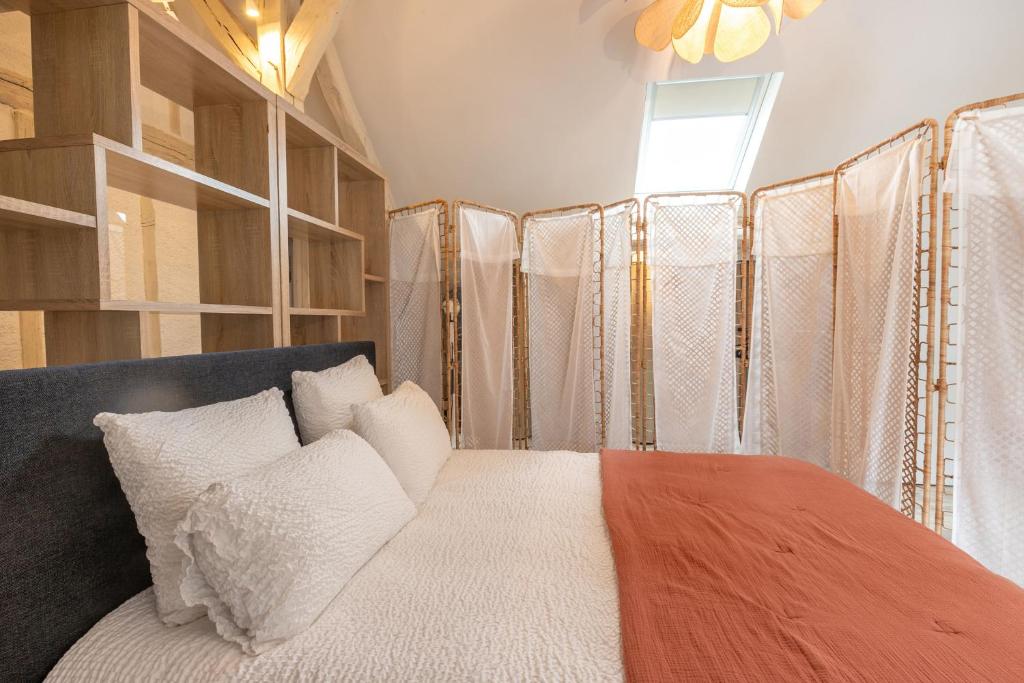 Posteľ alebo postele v izbe v ubytovaní Le Cottage de Chitenay