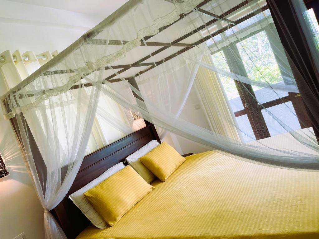 Ліжко або ліжка в номері New Cinnoman Villa