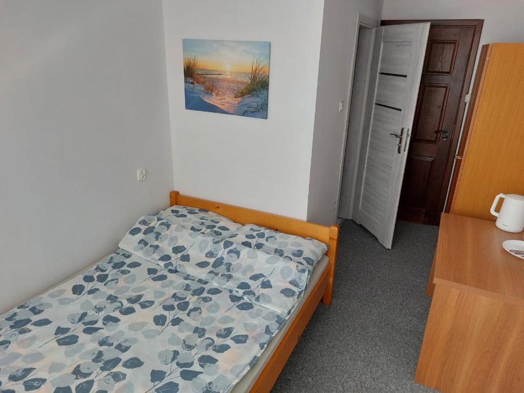 Ένα ή περισσότερα κρεβάτια σε δωμάτιο στο Pokoje Gościnne Viking