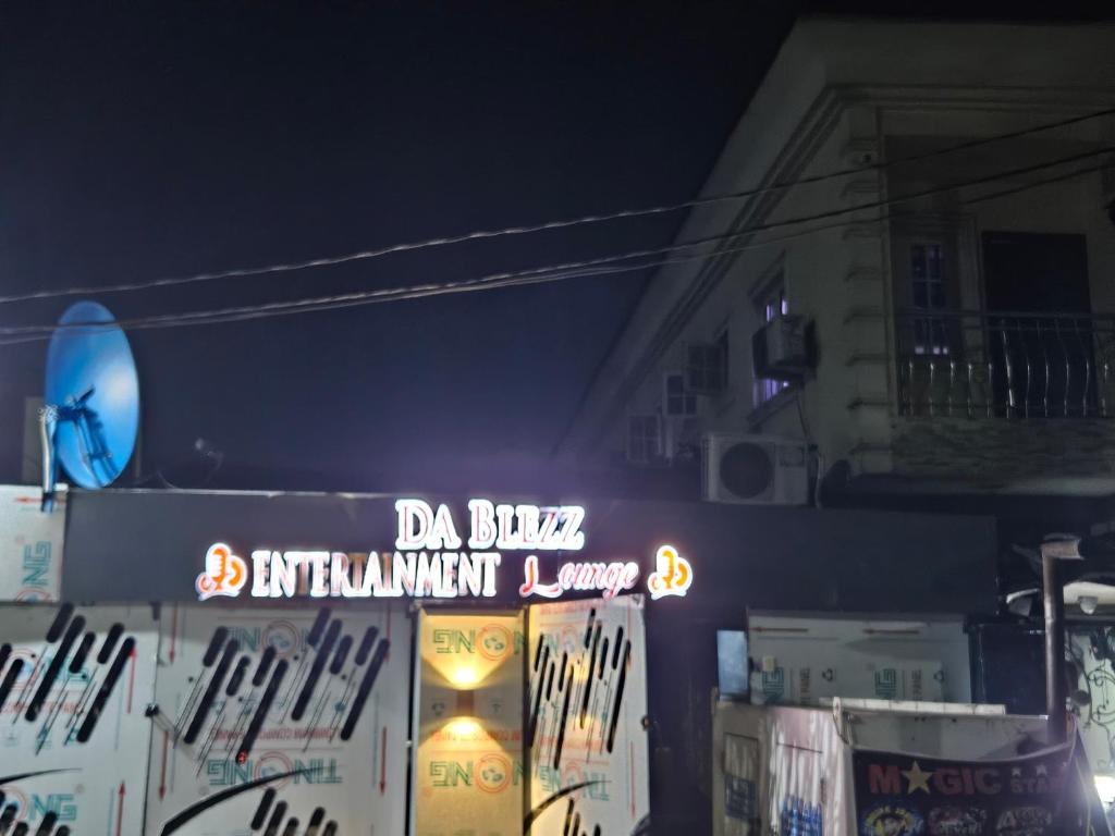 a sign that says d bubble equipment equipment center at night at Dablezz entertainment Lounge and Rooms in Lagos