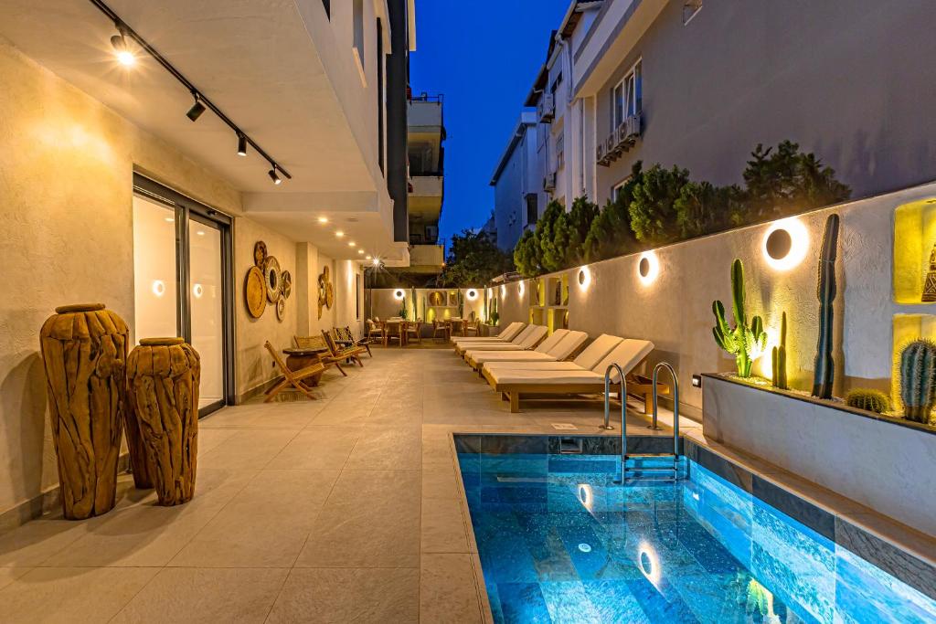 a swimming pool on the side of a building at Dulcet Hotel in Antalya