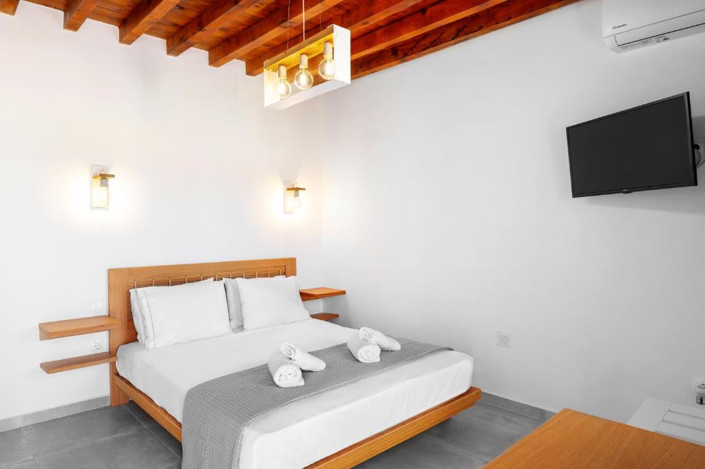 Postel nebo postele na pokoji v ubytování Pigados Beach House Kimolos