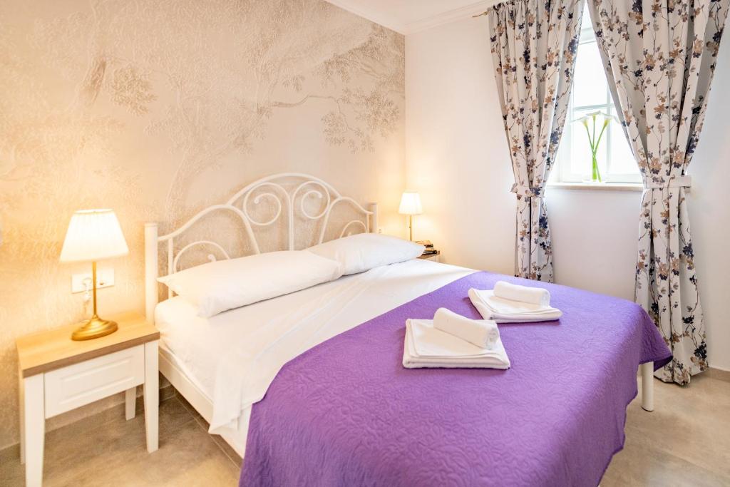 Posteľ alebo postele v izbe v ubytovaní Apartment Nico's
