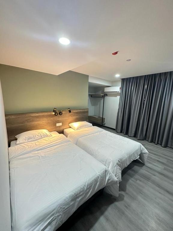 Postel nebo postele na pokoji v ubytování EpochHotel