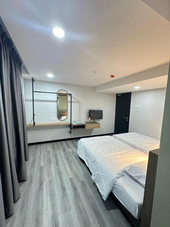 Postel nebo postele na pokoji v ubytování EpochHotel