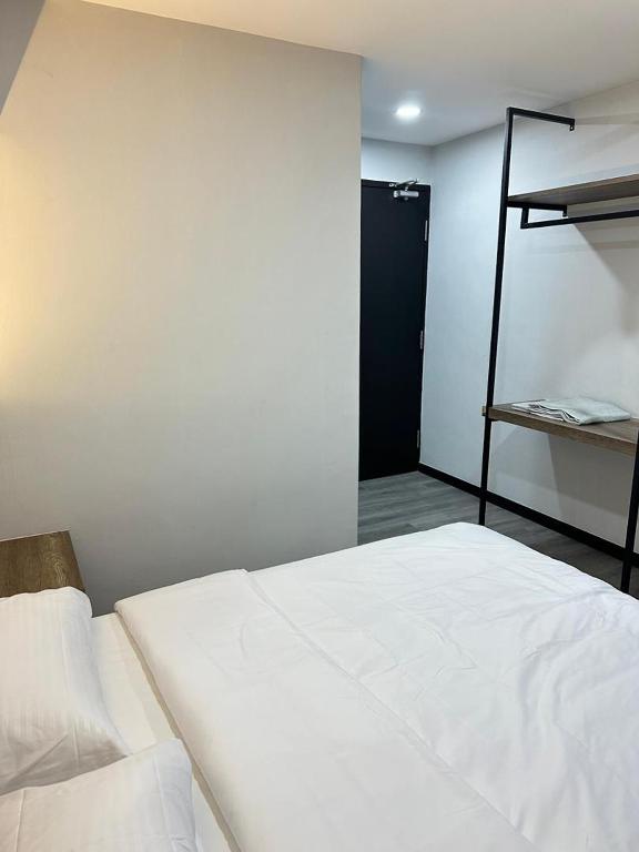 Postel nebo postele na pokoji v ubytování EpochHotel