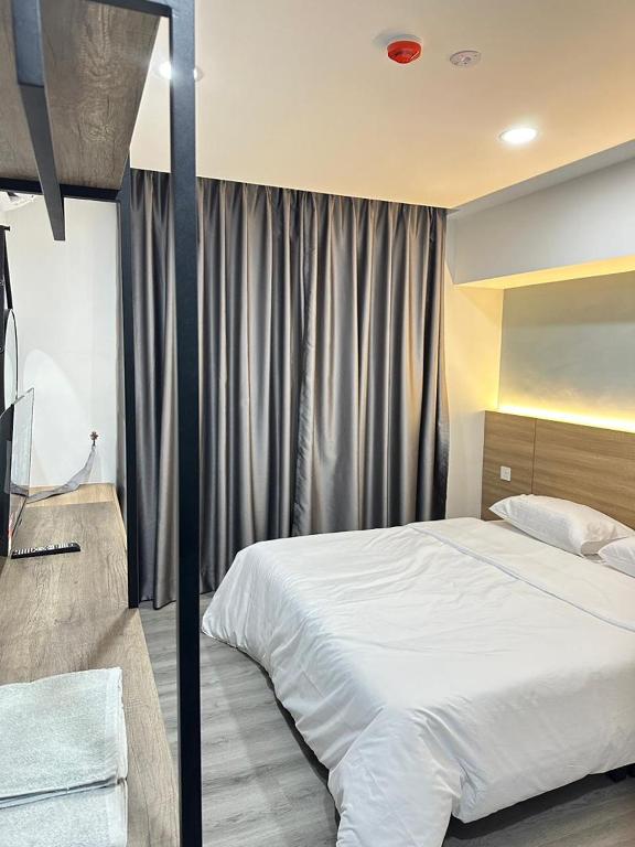 Postel nebo postele na pokoji v ubytování EpochHotel