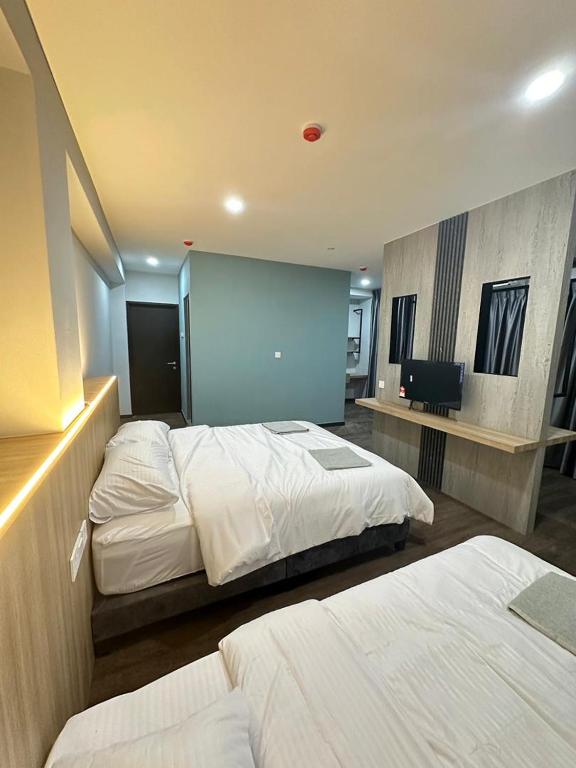 Postel nebo postele na pokoji v ubytování EpochHotel