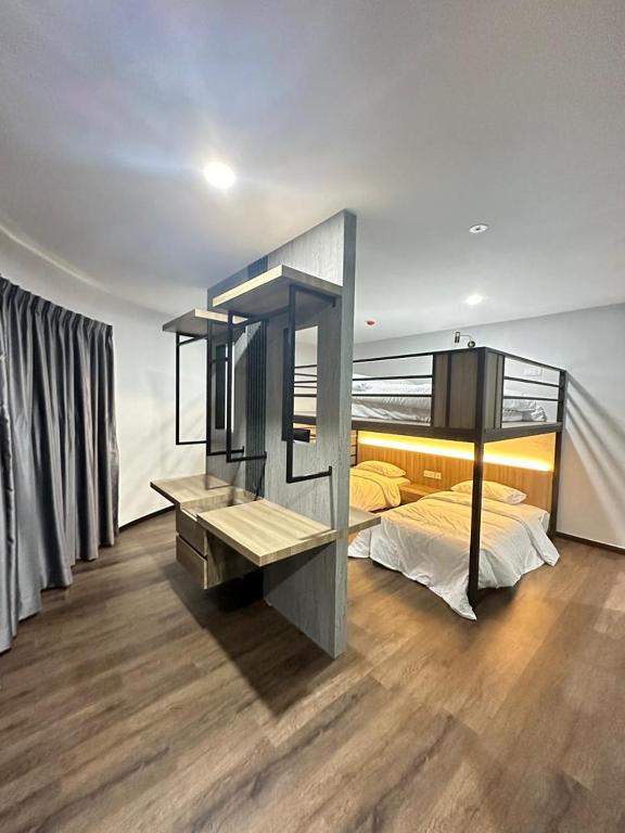 Postel nebo postele na pokoji v ubytování EpochHotel