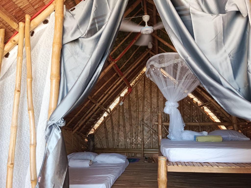 Postel nebo postele na pokoji v ubytování 8 Star Paradise