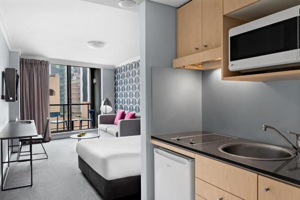 Ένα ή περισσότερα κρεβάτια σε δωμάτιο στο Mantra Sydney Central