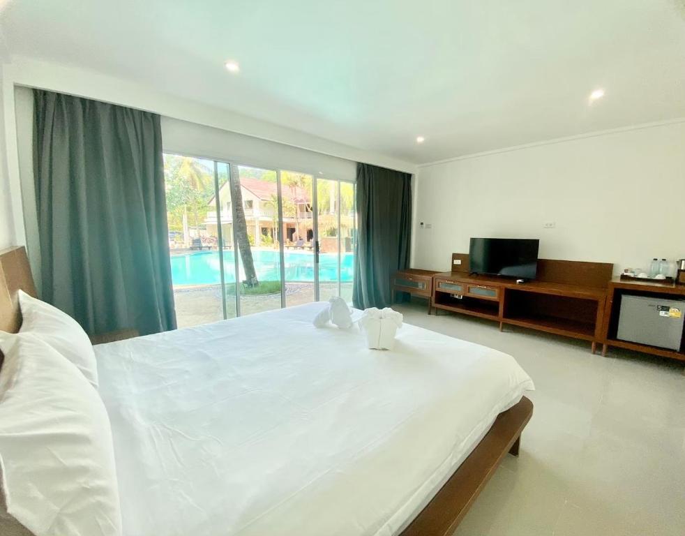 Postel nebo postele na pokoji v ubytování Vbeach Resort