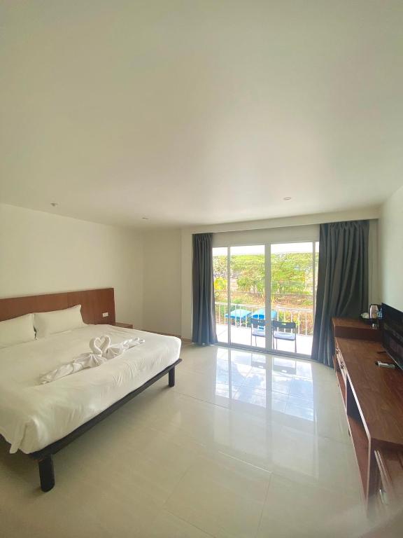 Postel nebo postele na pokoji v ubytování Vbeach Resort