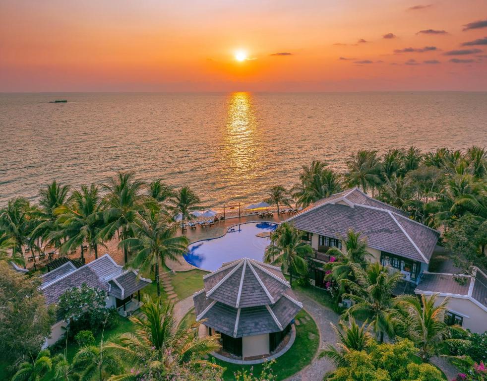 an aerial view of the resort at sunset at Anja Beach Resort & Spa in Phu Quoc
