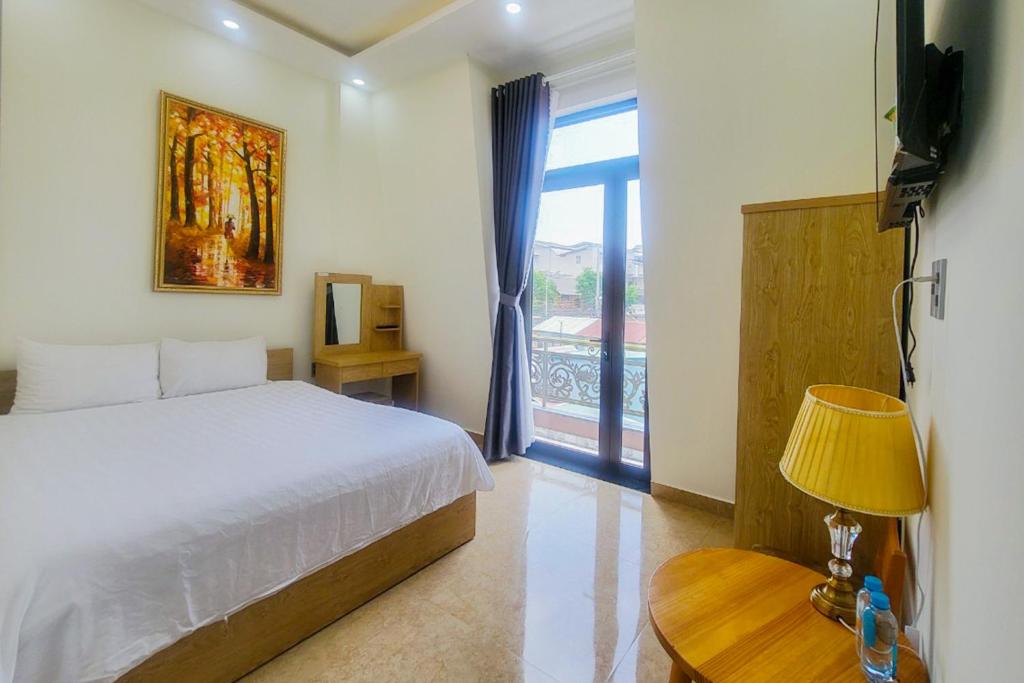 Giường trong phòng chung tại Mai DiaMond Hotel