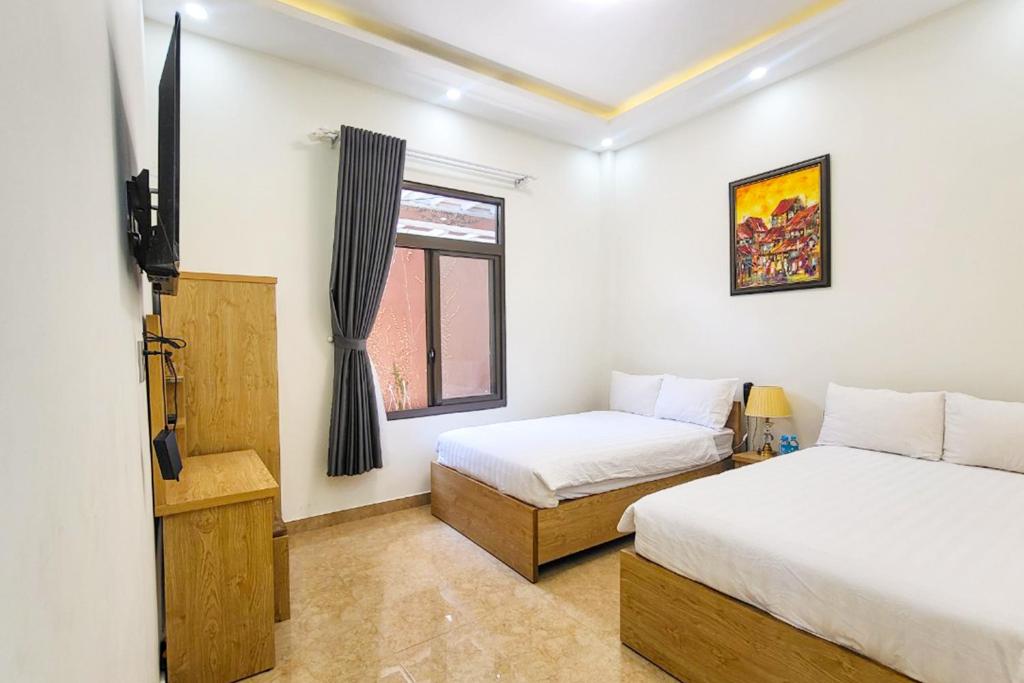 Giường trong phòng chung tại Mai DiaMond Hotel