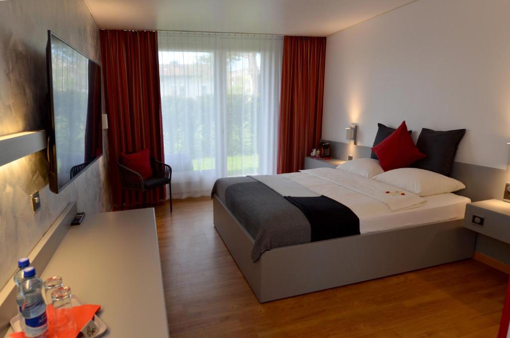 Postel nebo postele na pokoji v ubytování Hotel Egerkingen, idealer Zwischenstopp