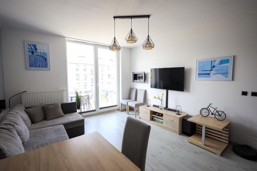 TV a/nebo společenská místnost v ubytování Apartament Kapitański
