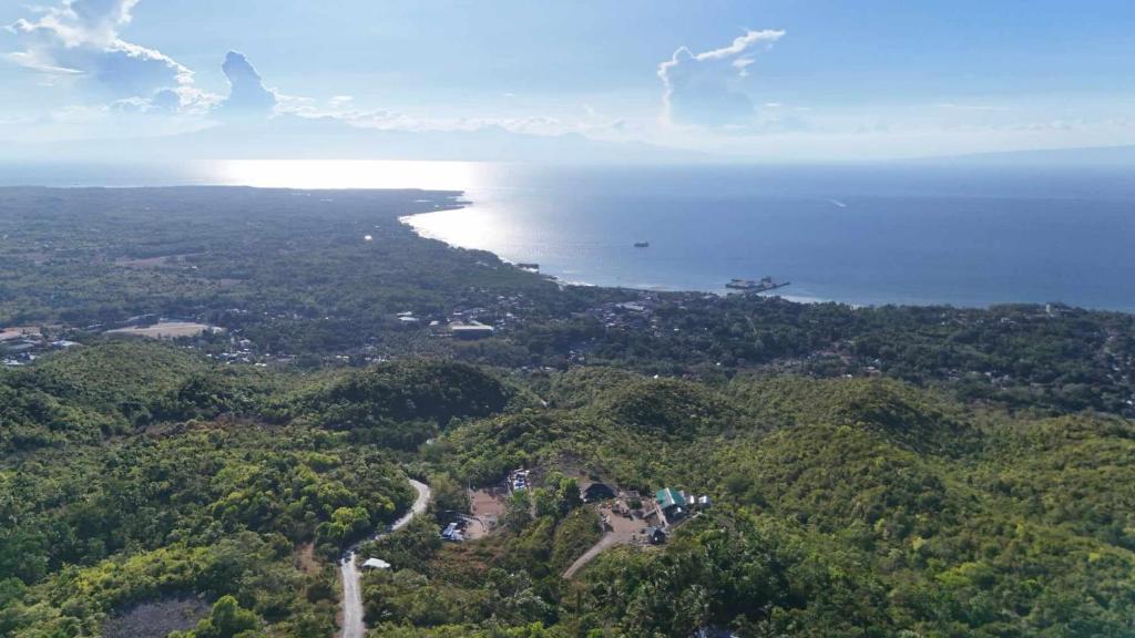 an aerial view of the ocean and an island at Thornton's Sea View Cafe & Guesthouse in Siquijor
