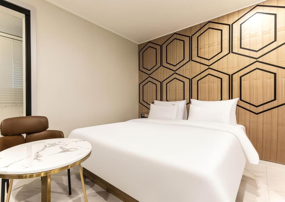 Ένα ή περισσότερα κρεβάτια σε δωμάτιο στο Carlton Hotel Bupyeong