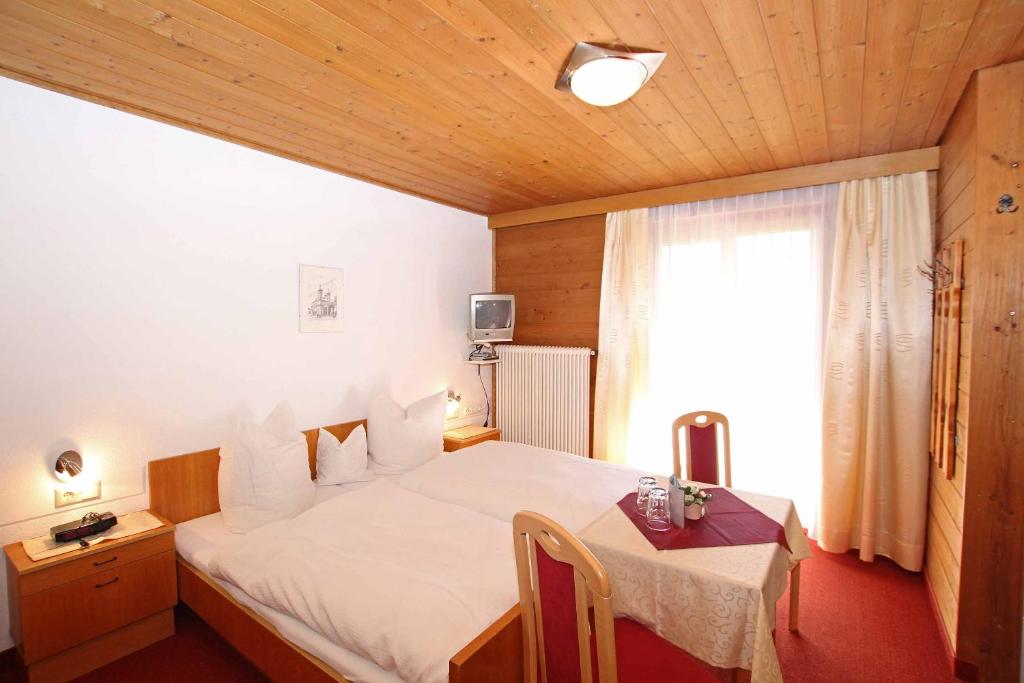 Postel nebo postele na pokoji v ubytování Pension Delacher
