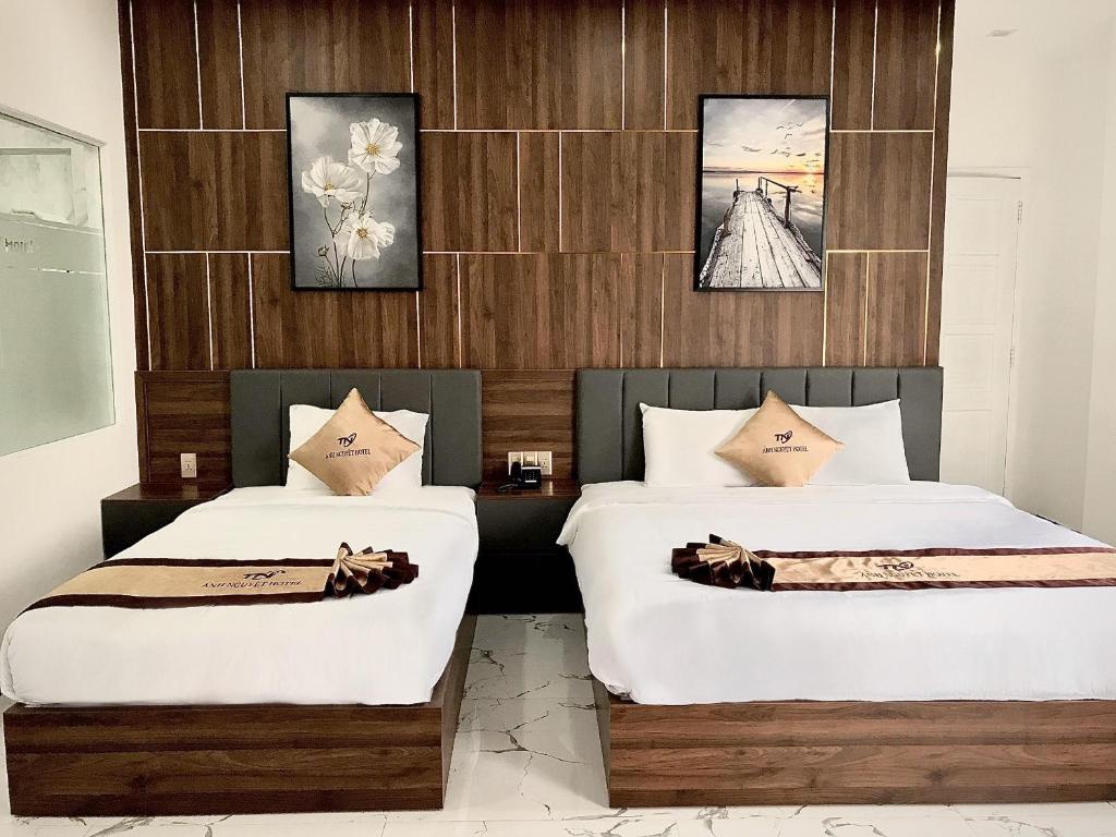 Postel nebo postele na pokoji v ubytování Anh Nguyet Da Nang Hotel