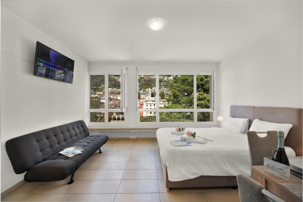 Postel nebo postele na pokoji v ubytování Alta Vista - Happy Rentals