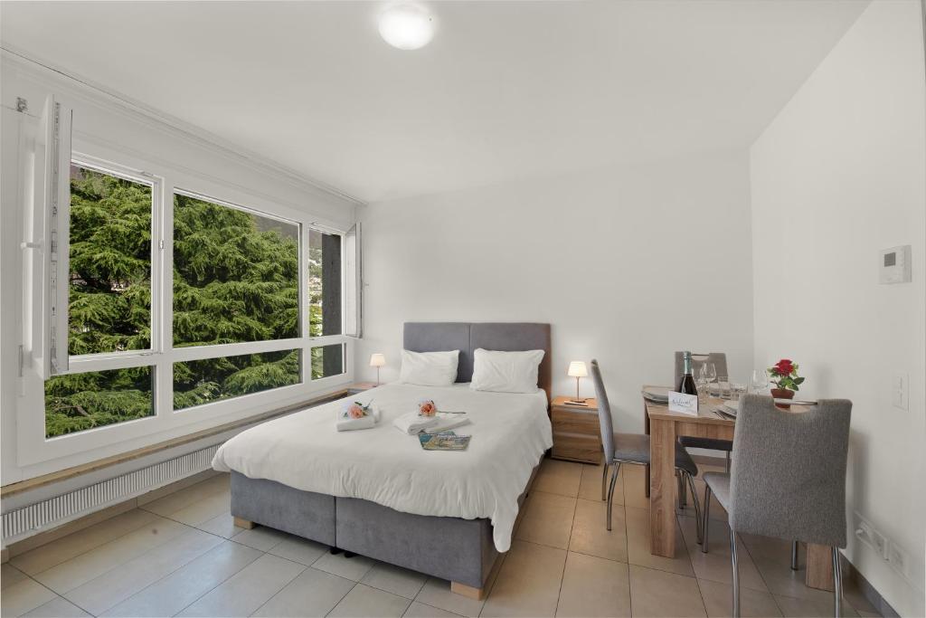 Postel nebo postele na pokoji v ubytování Alta Vista - Happy Rentals