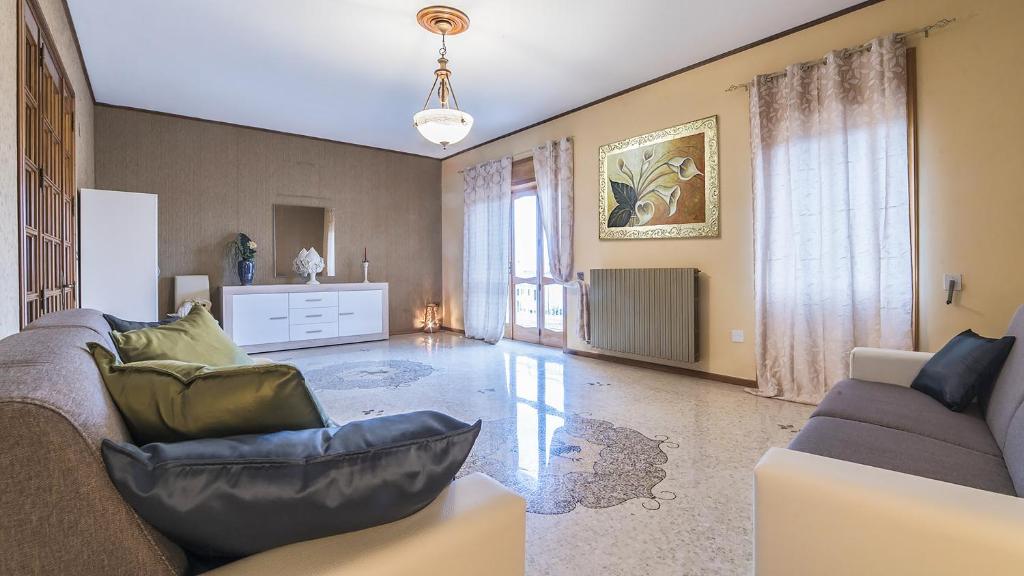 a living room with a couch and a table at Appartamento Stapane by Palazzo Stapane in Galatone