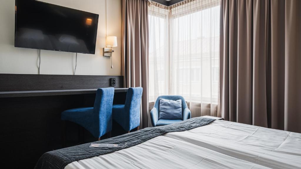 Postel nebo postele na pokoji v ubytování Comfort Hotel Skellefteå