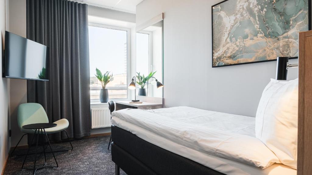 Postel nebo postele na pokoji v ubytování Comfort Hotel Skellefteå