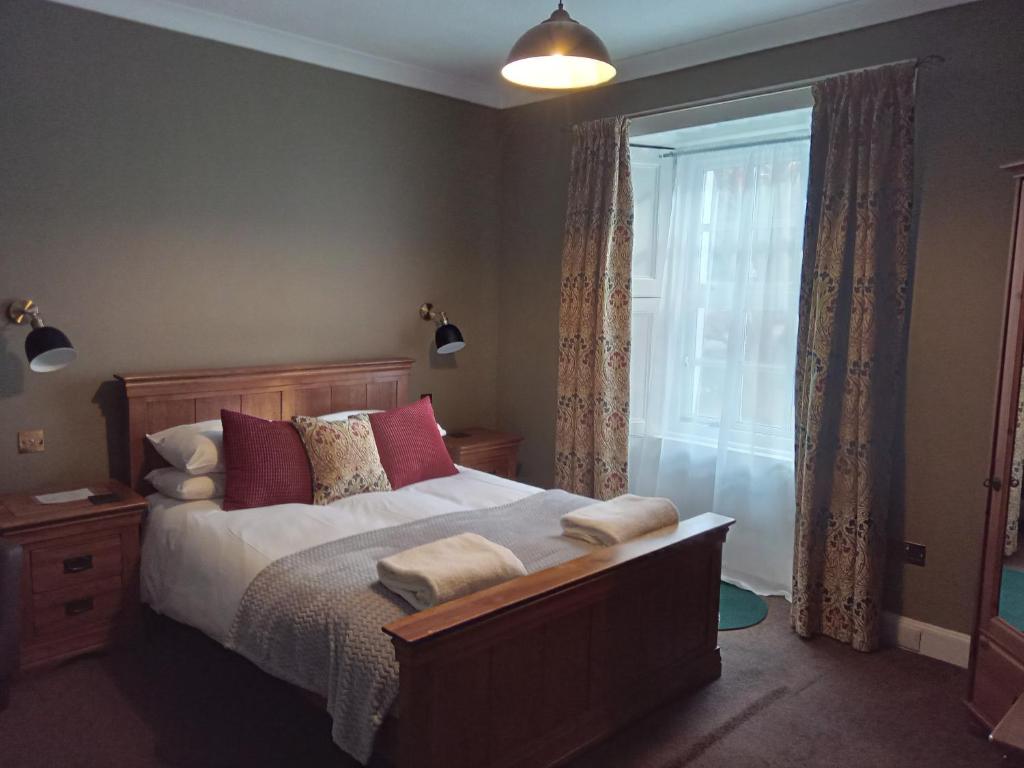 Postel nebo postele na pokoji v ubytování Lime Tree Hotel