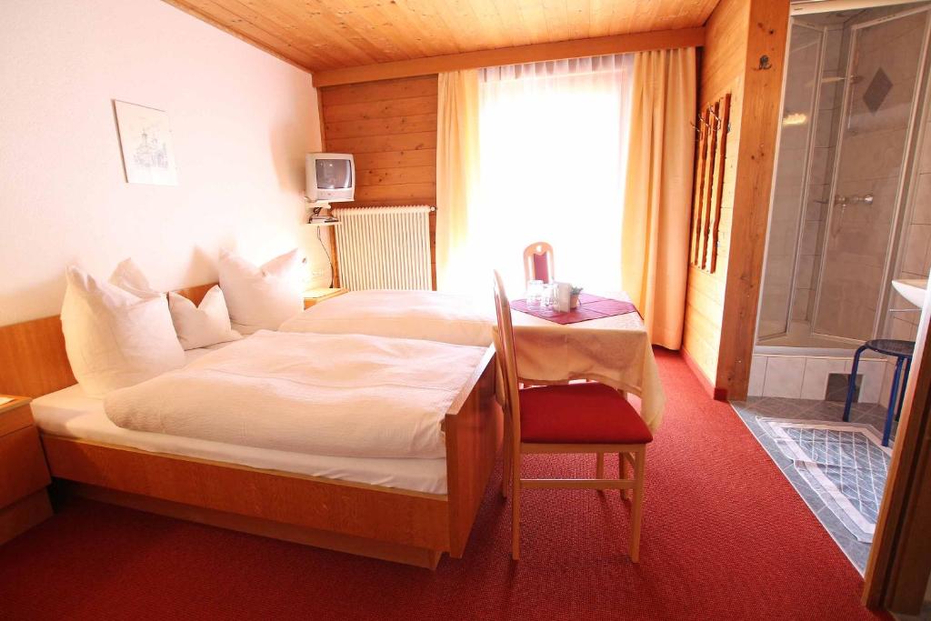 Postel nebo postele na pokoji v ubytování Pension Delacher
