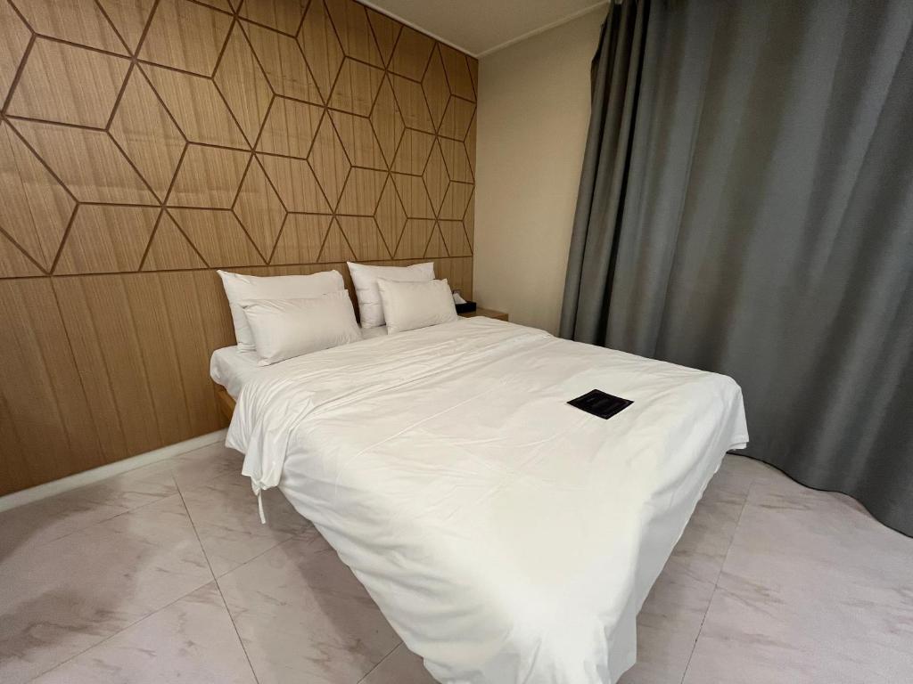 Postel nebo postele na pokoji v ubytování Carlton Hotel Bupyeong