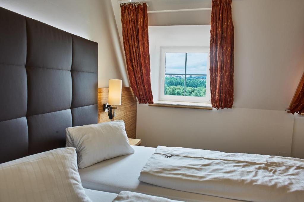 Postel nebo postele na pokoji v ubytování Landhotel Wachau