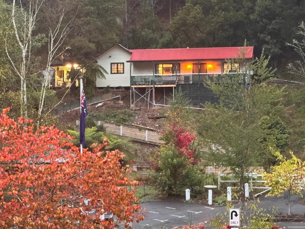 a house on a hill with a red roof at Lee Manor in Walhalla