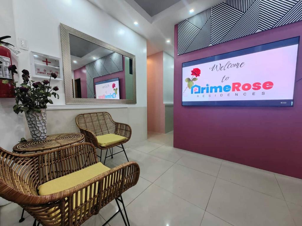 Televiisor ja/või meelelahutuskeskus majutusasutuses PrimeRose Residences - Near Mactan-Cebu International Airport