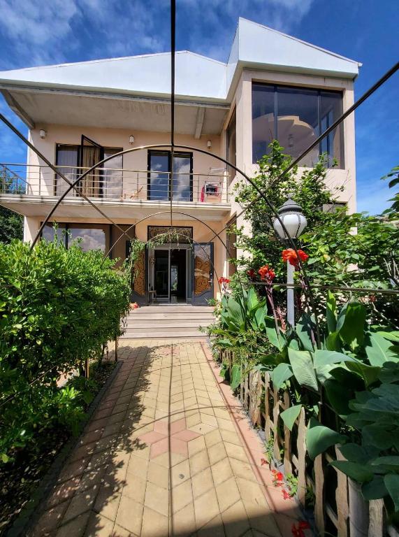 a house with a walkway in front of it at Kobuleti 327 a in Kobuleti