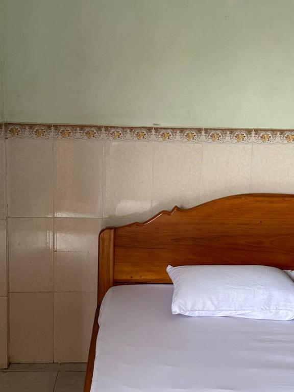 Postel nebo postele na pokoji v ubytování Palm Tree Guest House