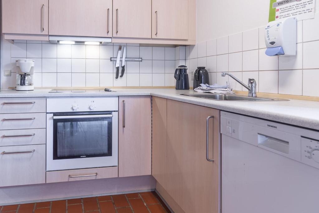 Kuchyň nebo kuchyňský kout v ubytování Sportsby Vejen - Danhostel, huse og lejligheder