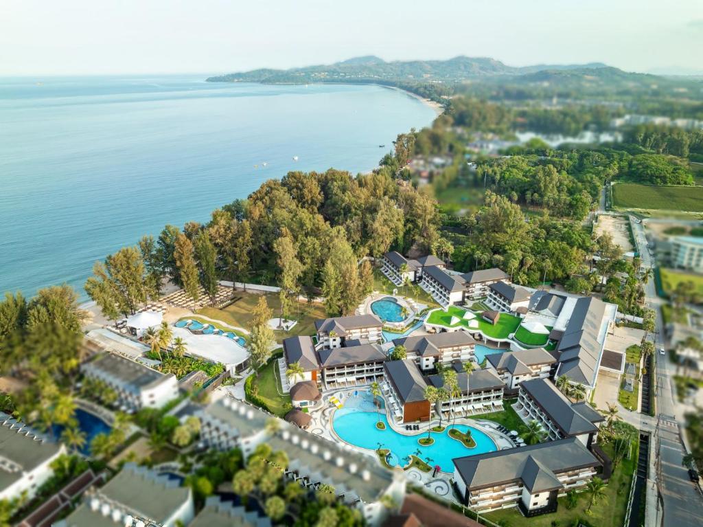 an aerial view of the resort with the waterpark at Amora Beach Resort Phuket - SHA Extra Plus in Bang Tao Beach