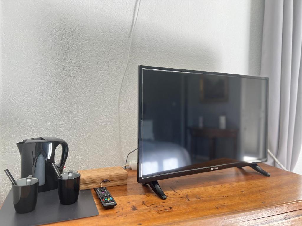 TV a/nebo společenská místnost v ubytování L'Ariade