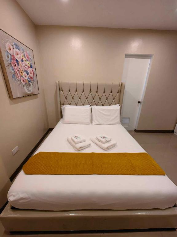 Voodi või voodid majutusasutuse PrimeRose Residences - Near Mactan-Cebu International Airport toas